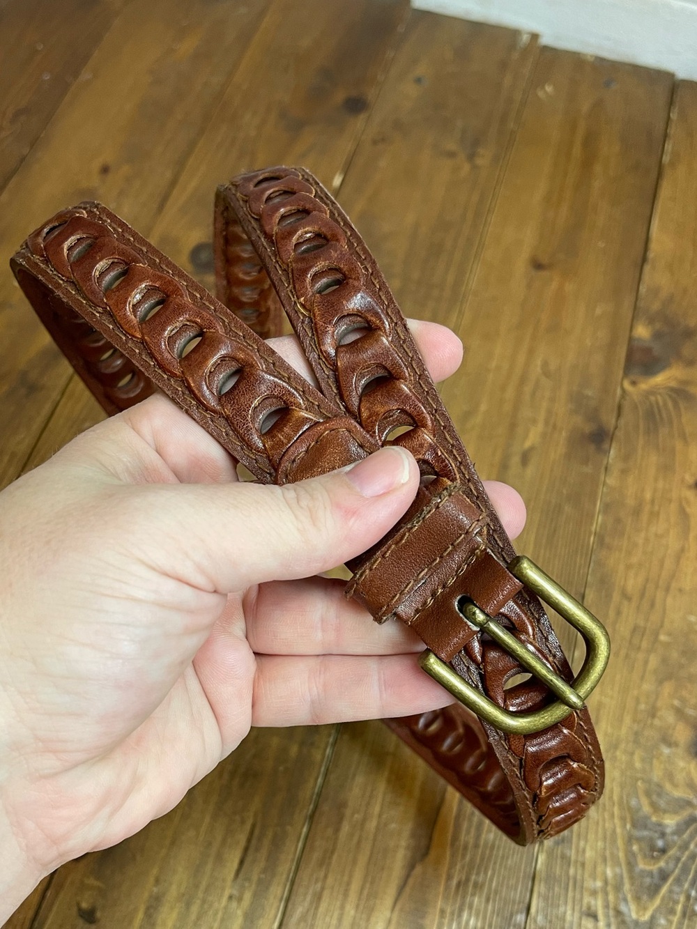Brown linked leather belt about a size small